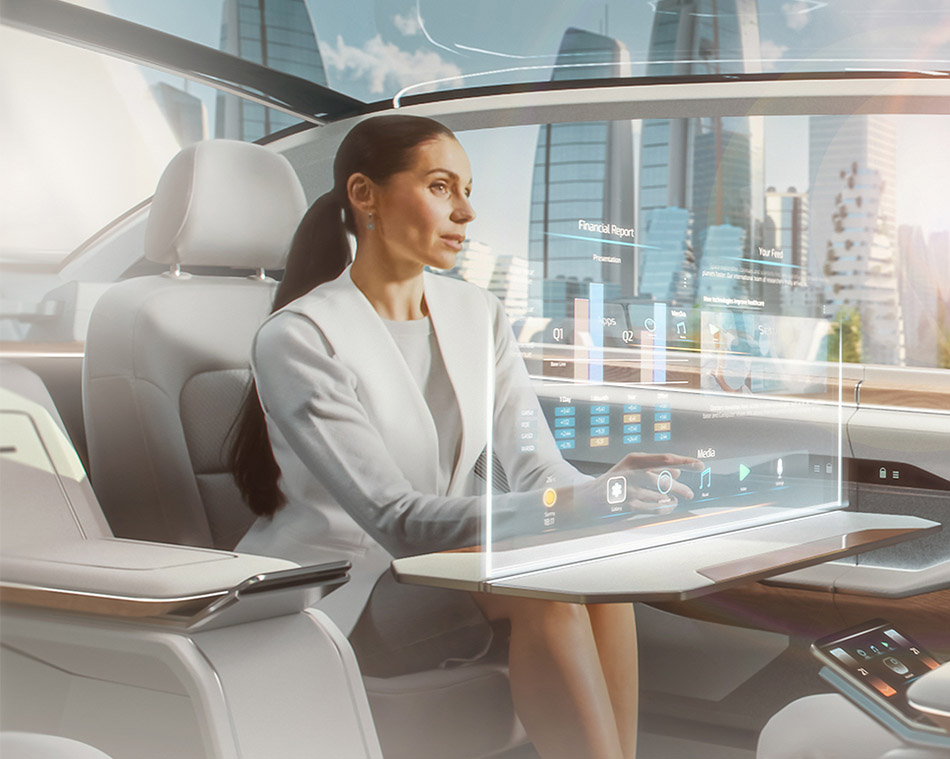 Woman sitting in a self-driving car (photo)