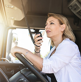 Truck driver talking over her radio (photo)